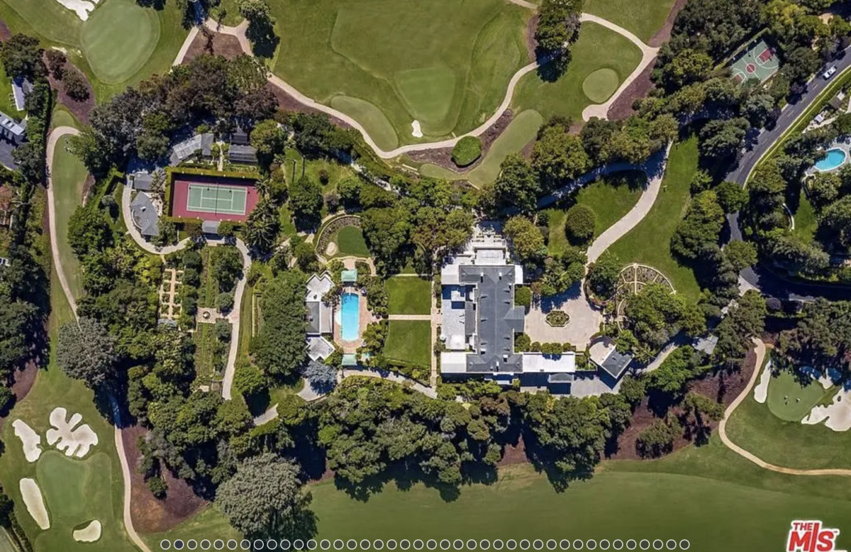 Niche Communities 9 aerial view of a large house with a pool and golf course