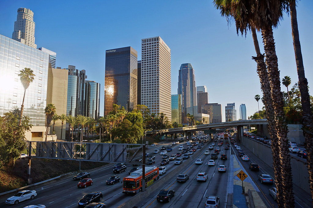 Niche Communities 25 a traffic on a freeway with a city skyline in the background