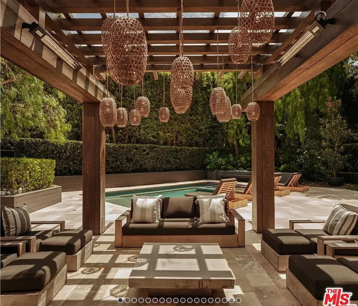 a patio with a pool and chairs