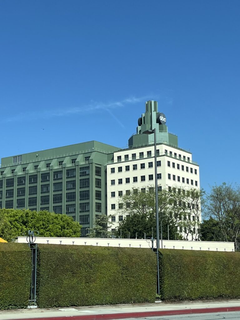 a building with trees and a fence