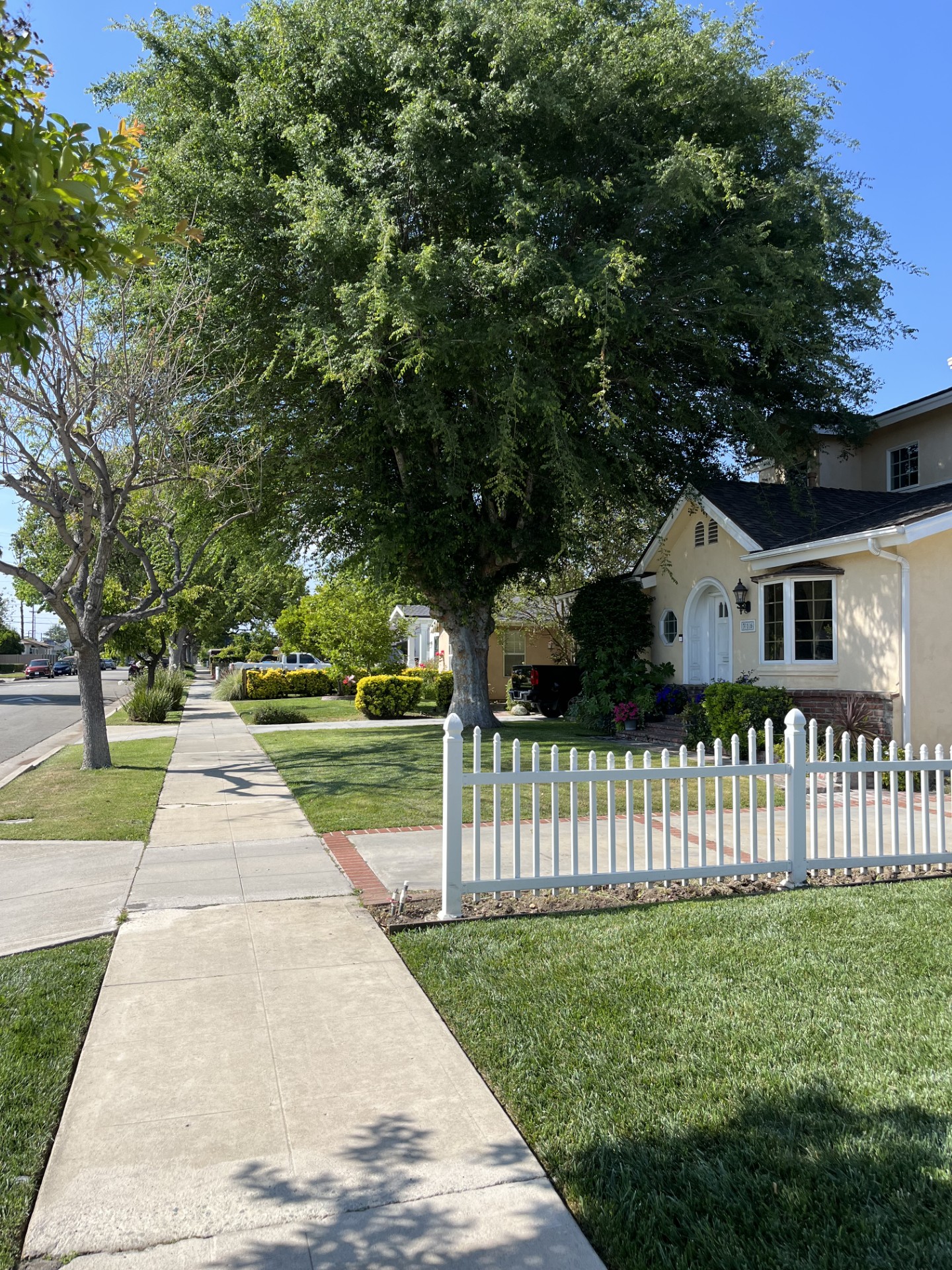 A white fence in front of a house