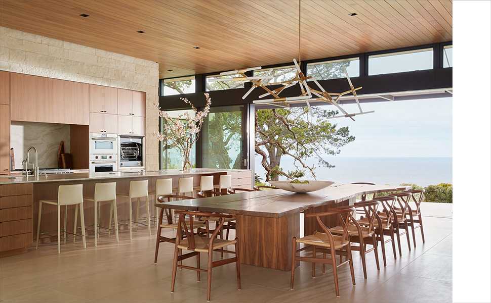 luxury kitchen with large wooden modern table