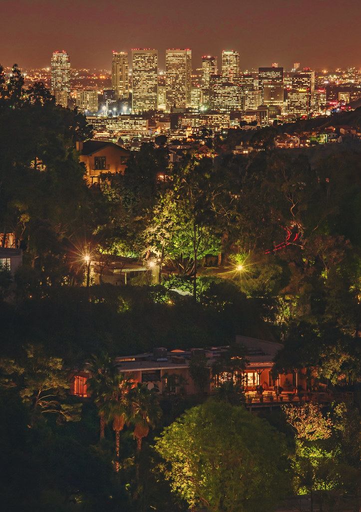 hollywood hills neighborhood and city lights in background