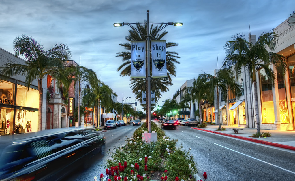 road with shops and palm trees in beverly hills