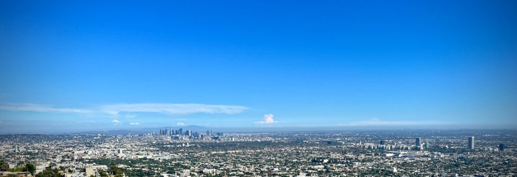 a view of a city from the top of a hill