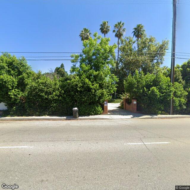 Street view of Los Angeles residential neighborhood showing homes eligible for ADU and SB 9 development opportunities