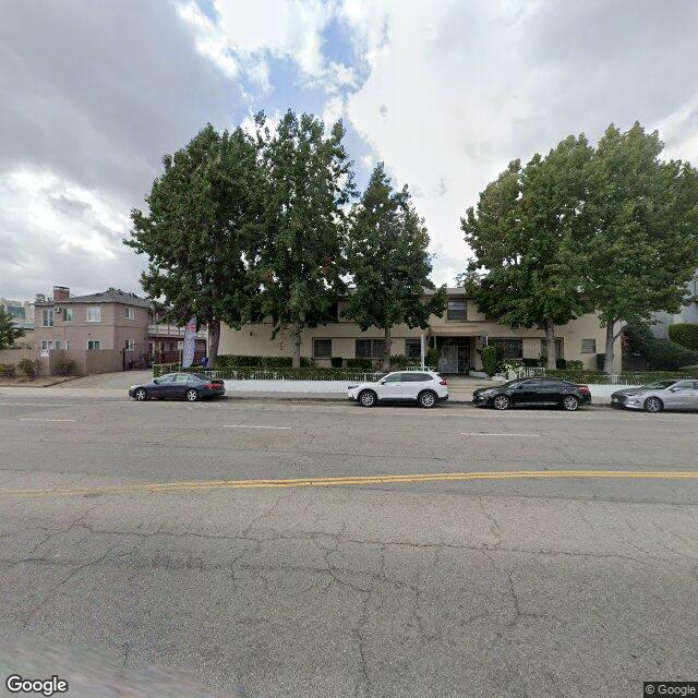 Benefits of Buying an Off-Market Home in Los Angeles 1 Street view of exclusive Los Angeles neighborhood featuring luxury homes and tree-lined streets