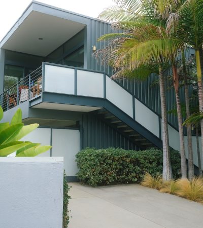 Northeast Santa Monica a building with a balcony and palm trees in front of it