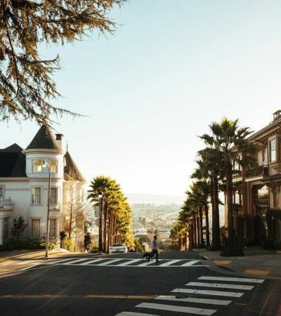 Photo by Robert Bye houses near road with palm trees