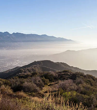 Altadena a landscape of a mountain with a city in the distance