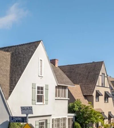 a row of houses with a street sign