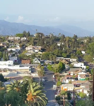 Northeast Los Angeles a city with trees and mountains in the background