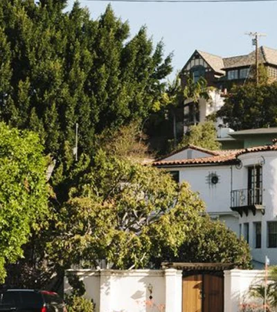 Oxford Square a white building with a large tree in the background
