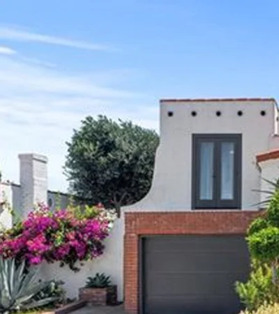 a house with a garage and trees