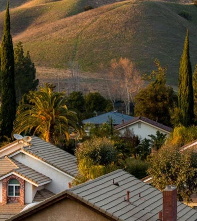 Porter Ranch a group of houses with trees and hills in the background