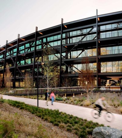 rios architects glass and steel building with sidewalk in front