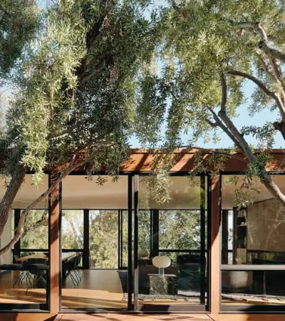 Reseda a glass house with trees around it