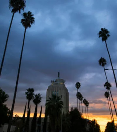 Van Nuys a tall palm trees and a building