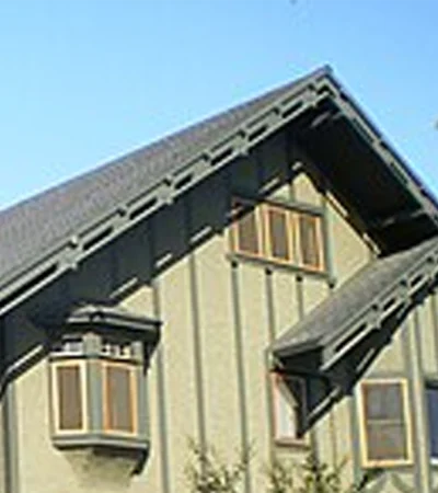 a house with a palm tree in the background