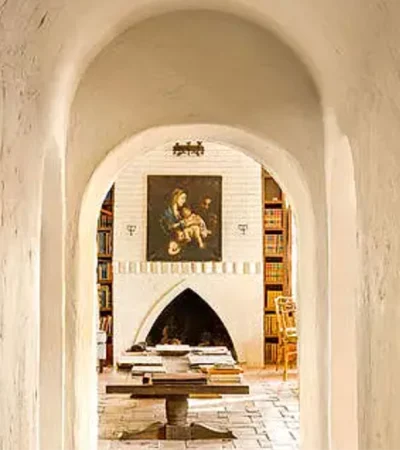 a hallway with a painting on the wall