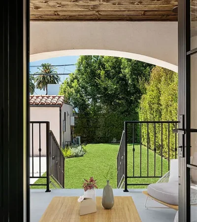 Wilshire Highlands a patio with a chair and a table on it