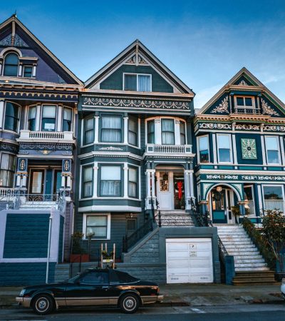 Historic Victorian architecture homes in Alamo Square, San Francisco with city skyline views