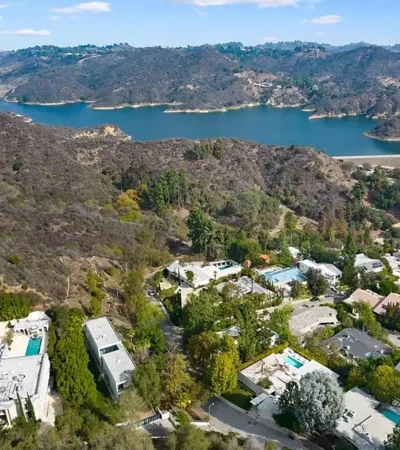 a aerial view of a town with a body of water