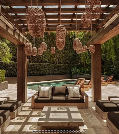 a patio with a pool and chairs