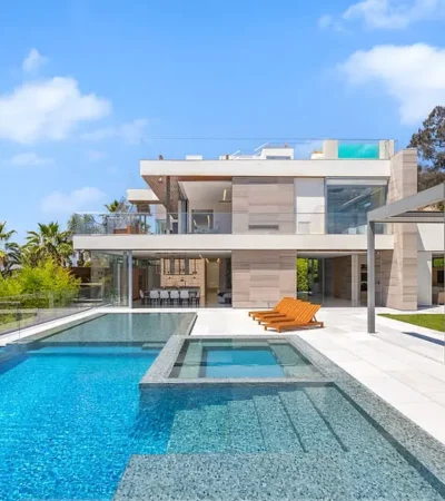 a pool and a house with a large deck