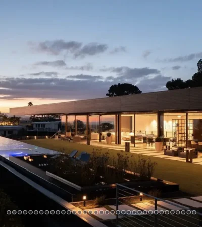 a house with a pool and a large glass building