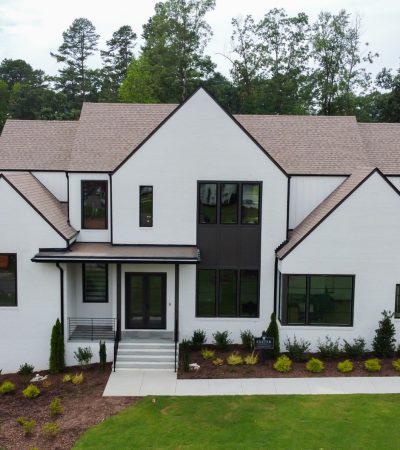 Luxury home in Country Club Estates neighborhood with elegant architecture and manicured landscaping