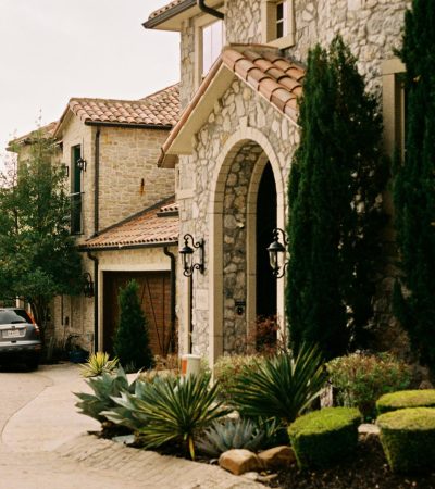 Elegant courtyard of a luxury home in Los Angeles featuring classic architecture and manicured landscaping