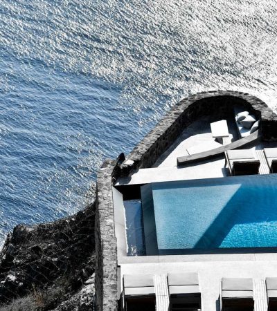 homes for sale with amazing pools gray and white concrete building over body of water