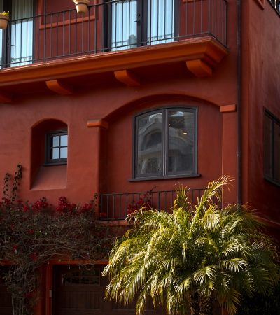 condos for sale in glendale ca  a red building with a palm tree in front of it