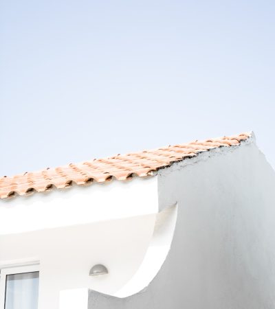 spanish style homes for sale los angeles  a cat sitting on the roof of a building