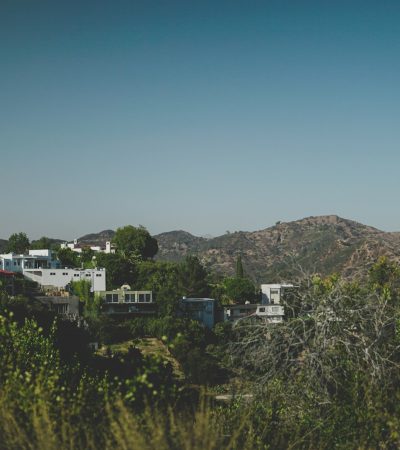 hollywood hills condos  a view of a mountain range with houses in the foreground