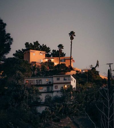 promontory homes for sale buildings near green trees during nighttime