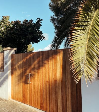 Woodland Hills Gated Homes for Sale a wooden gate with a palm tree in the background