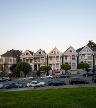 Victorian homes on tree-lined street in Haight Ashbury, San Francisco real estate market