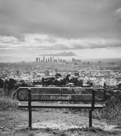 los angeles homes for sale grayscale photo of bench near city buildings