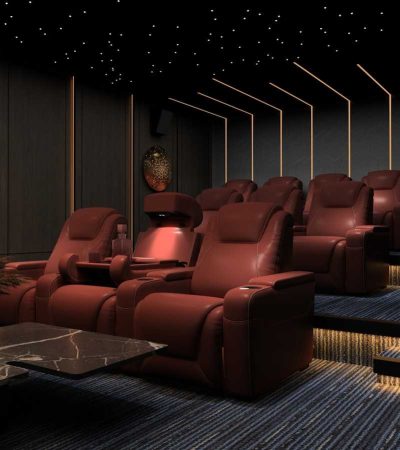 house with movie theater for sale a room filled with red chairs and a table