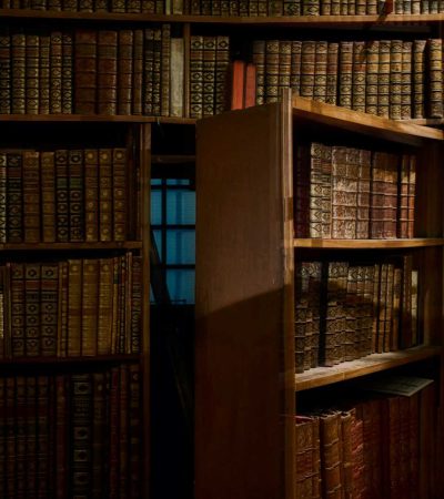 homes for sale with safe room opened secret door inside library