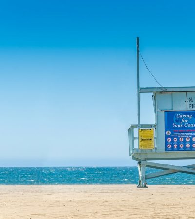 Ocean Park blue wooden lifeguard house on beach during daytime