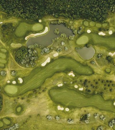 aerial shot of golf course and sand bunkers