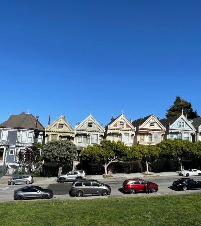 Vibrant Inner Mission neighborhood street in San Francisco with Victorian architecture and modern retail