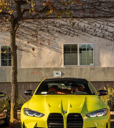 Mid-City Santa Monica a yellow sports car parked next to a tree