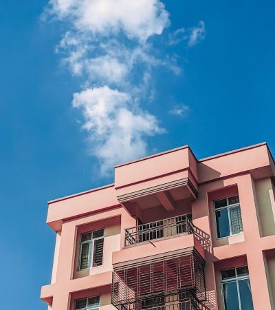 condos for sale in porter ranch  pink and white concrete building under blue sky during daytime