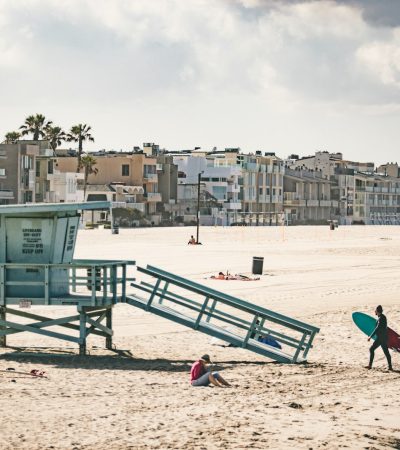 group of people near lifeguard house at beach