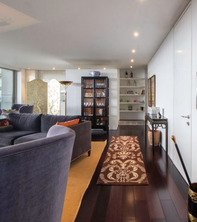 Modern luxury condo interior in Los Angeles with floor-to-ceiling windows and contemporary furnishings