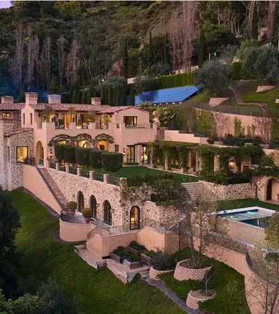 a large house with a pool on the side